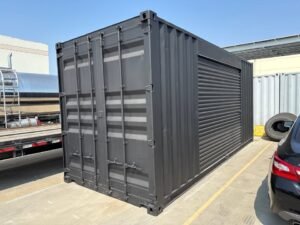 518277105_24084520581203502_1136656330675810502_n.jpg 20ft Used Shipping Container – Matte Black w/ 12’ Side Roll-Up Door